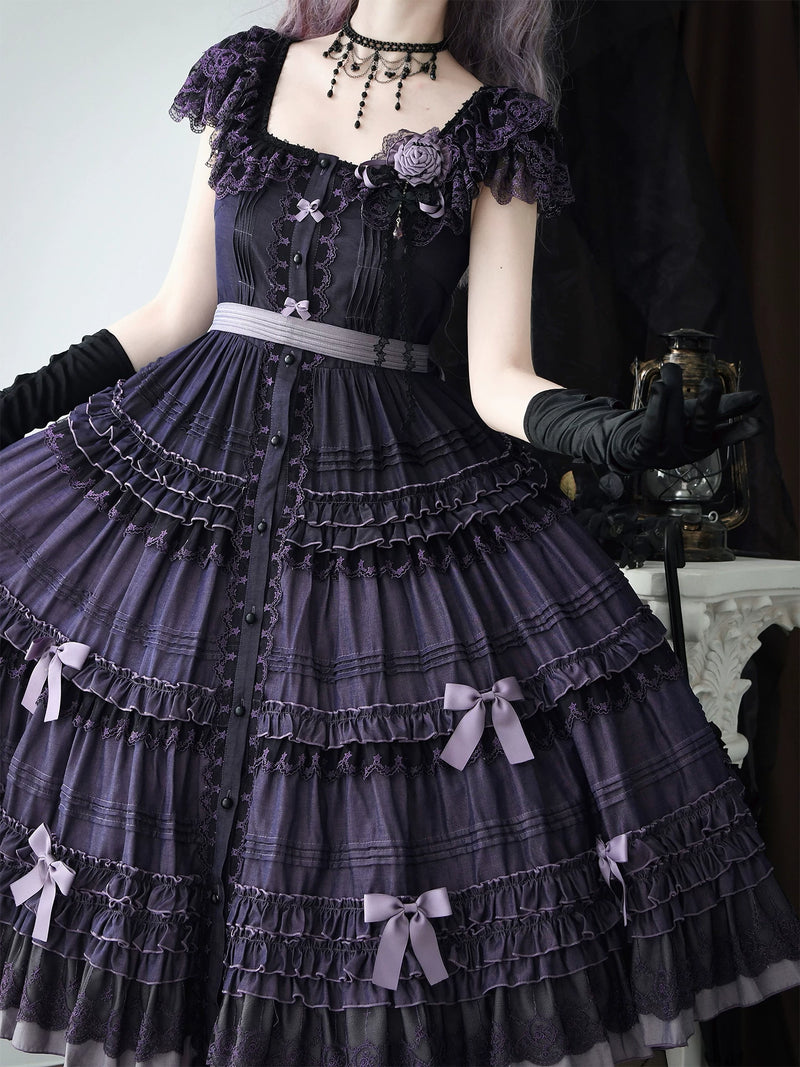 Full view of the JSK's multi-tiered skirt with lace inserts and small bow accents