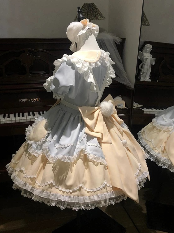 Sweet Tea Girl sweet Lolita pink short sleeve OP dress with cat-themed motifs and waist bow displayed on a mannequin