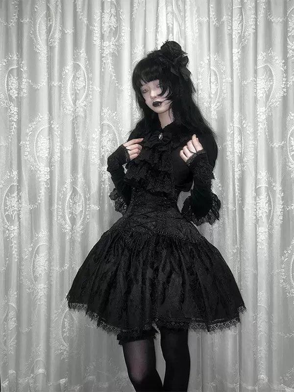 Creamy black blouse and SK skirt set with ruffled details and drool bib
