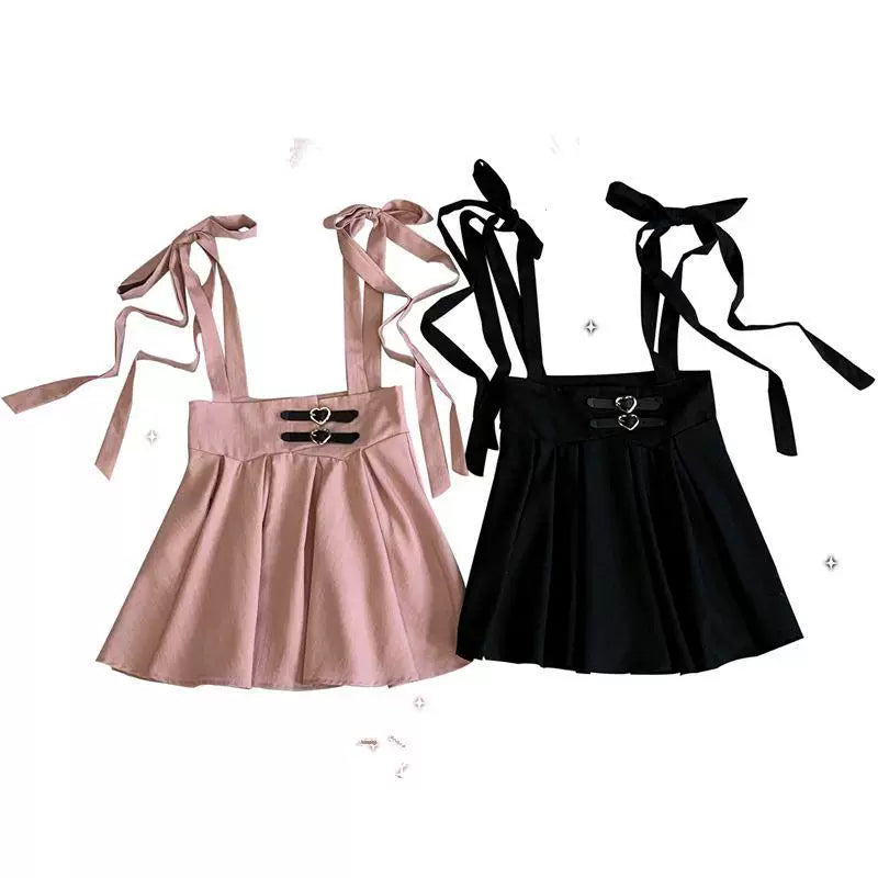 Two models wear the pink-skirt and black-skirt Love Imprisonment JSK with heart-shaped waist buckles.