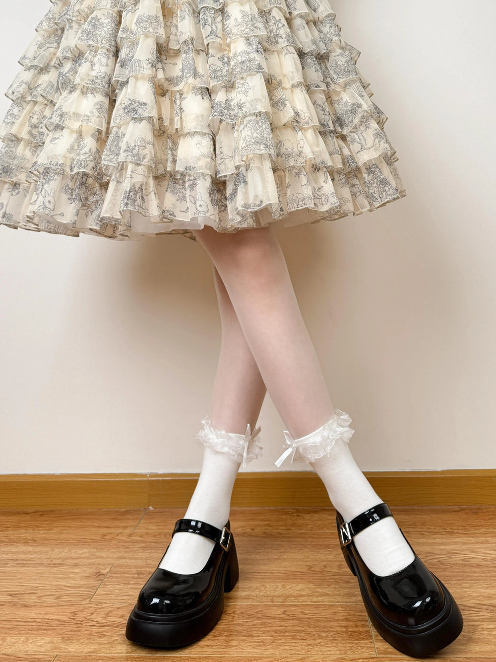 White and black layered ruffle socks with lace edging and bows
