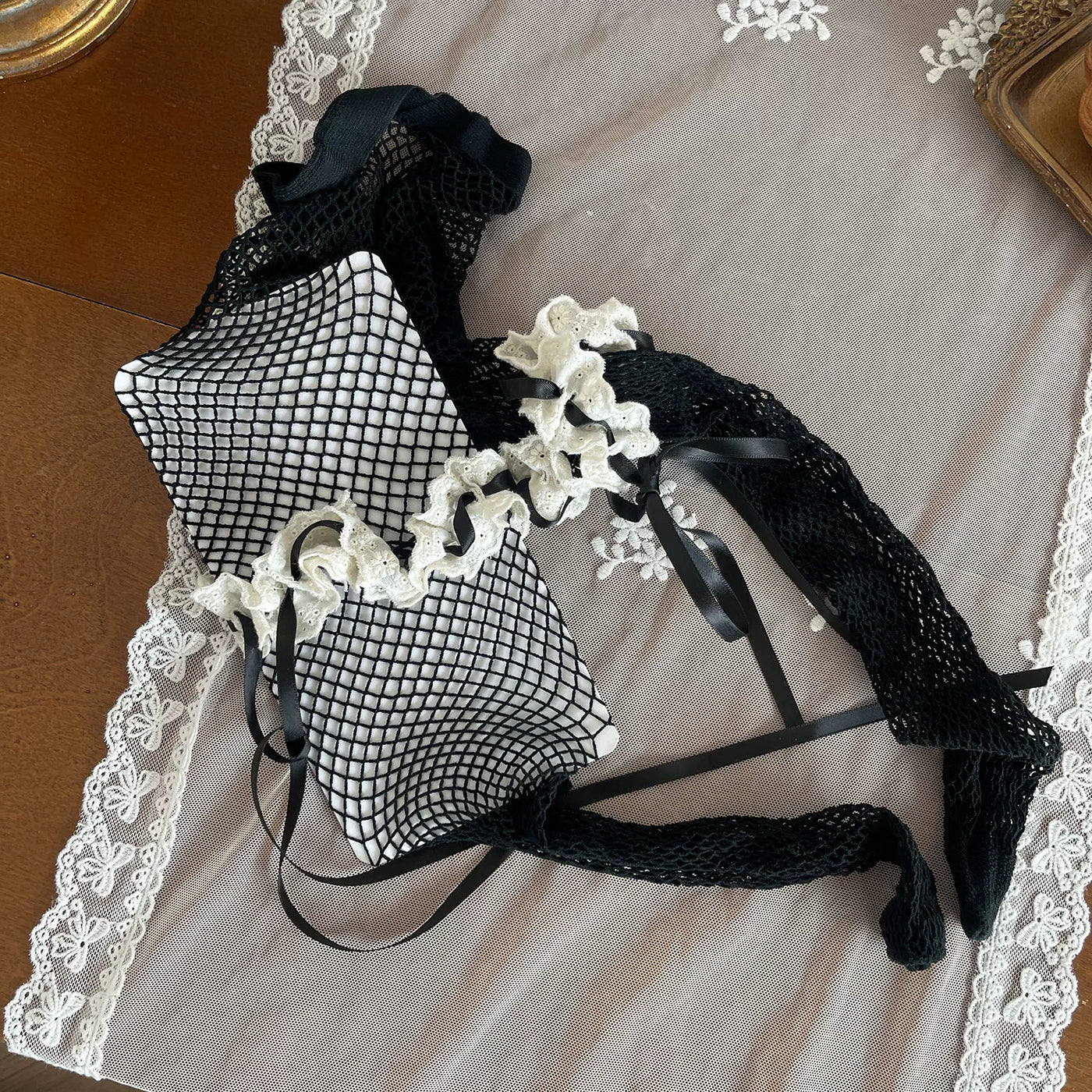 Sock Noble black layered fishnet and lace hosiery with white ruffles
