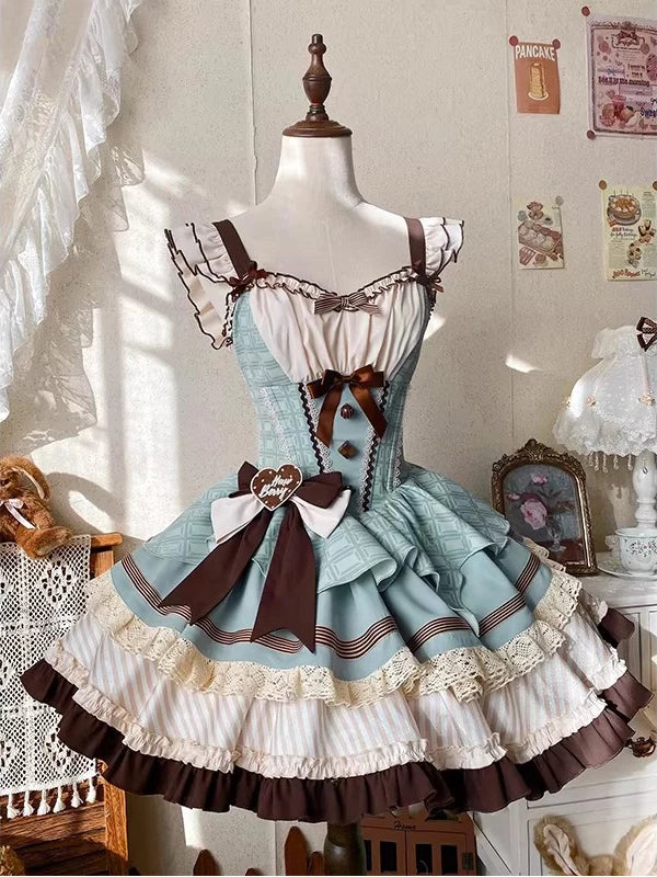 Creamy mint JSK skirt with chocolate-brown bows and cream ruffles on a mannequin
