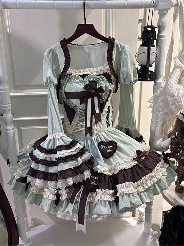 Mint-and-chocolate JSK dress and hime-sleeve shoulder vest set displayed on a hanger