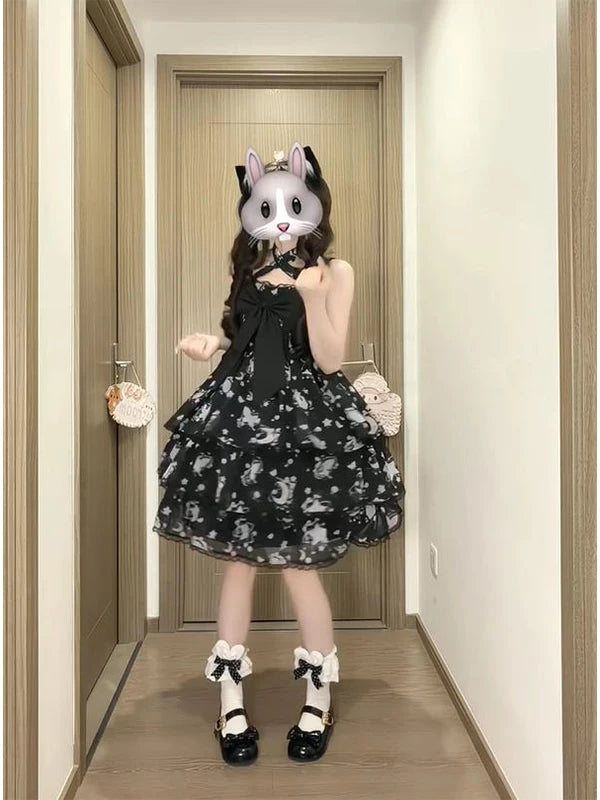 Black printed JSK with a large bow styled on a model.