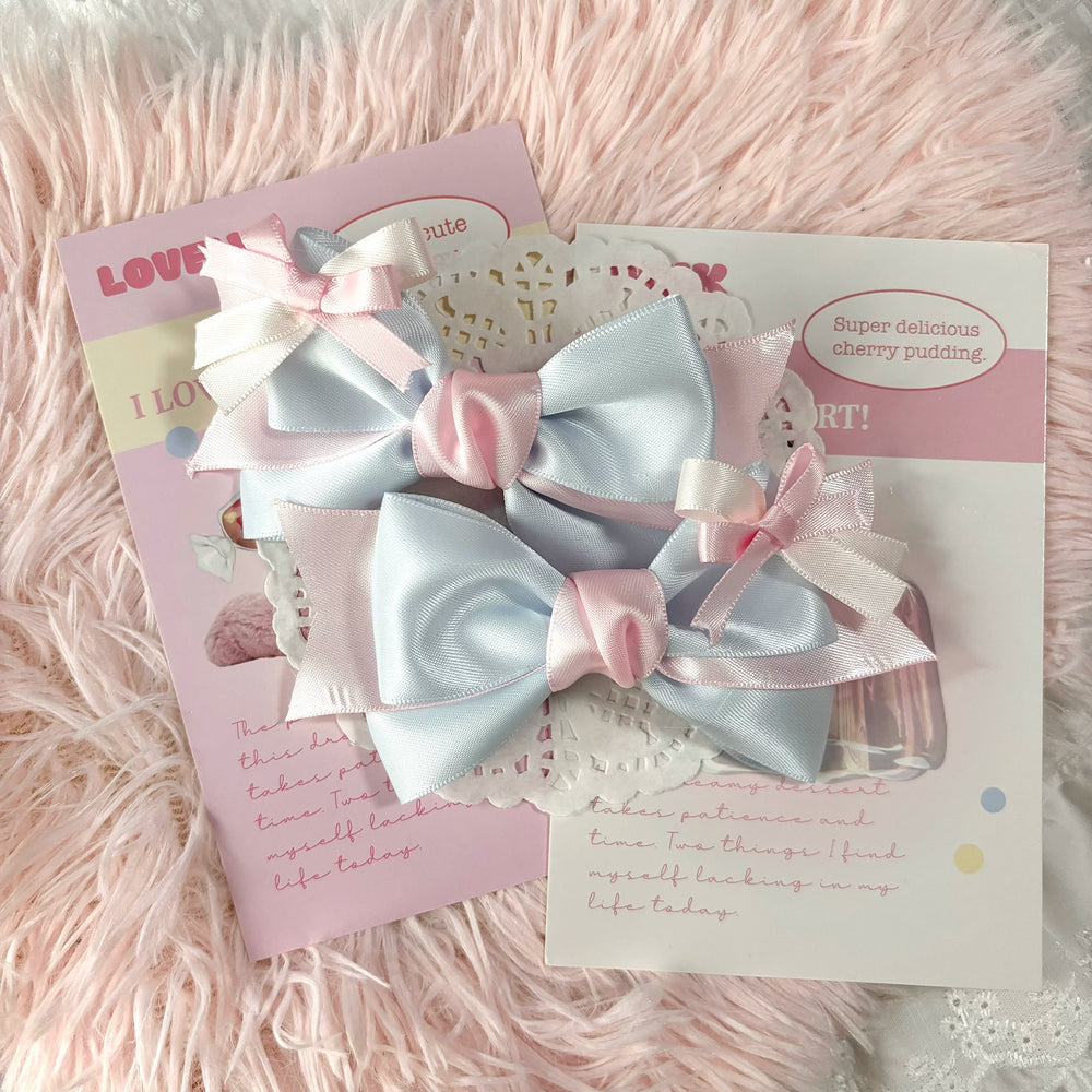 Blue and pink layered bow hair clip with ribbon tails