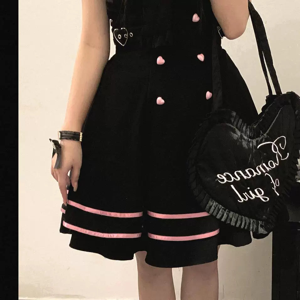 Black and pink puffy skirts with heart-shaped buttons and contrasting ribbon border trim