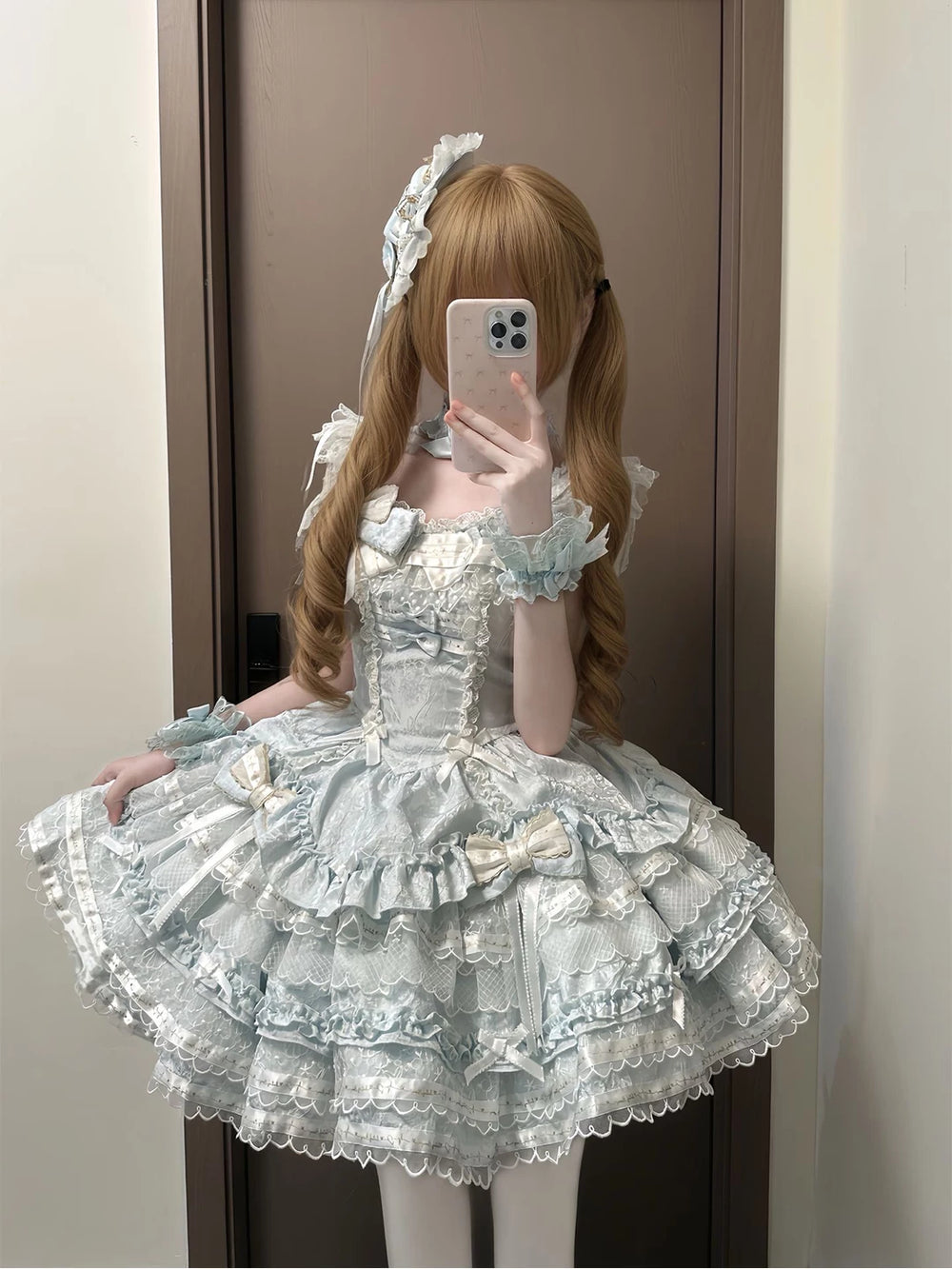 Pale blue tiered JSK dress with white lace, bows, and a full skirt.