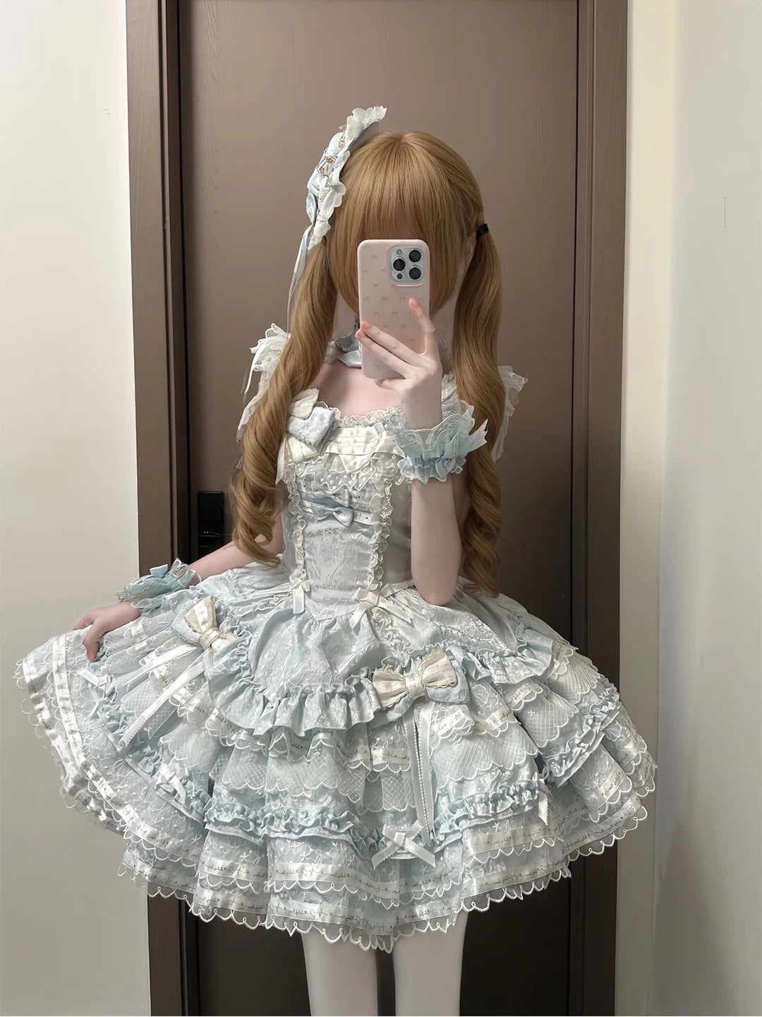Pale blue tiered JSK dress with white lace, bows, and a full skirt.