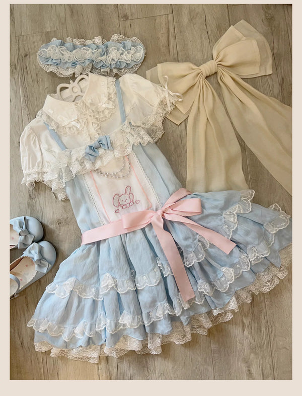 Blue layered-ruffle JSK with rabbit details and large bows styled on a model.