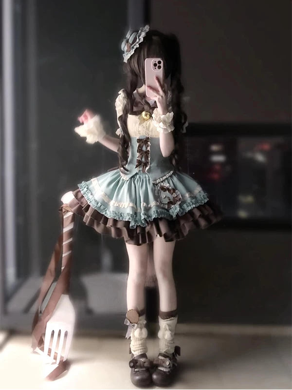 Model wearing a mint, cream and brown layered JSK set with bows.