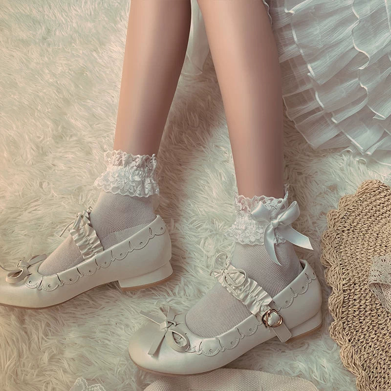 Close-up of lace ruffle trim and fabric bow on Sweet Lolita socks