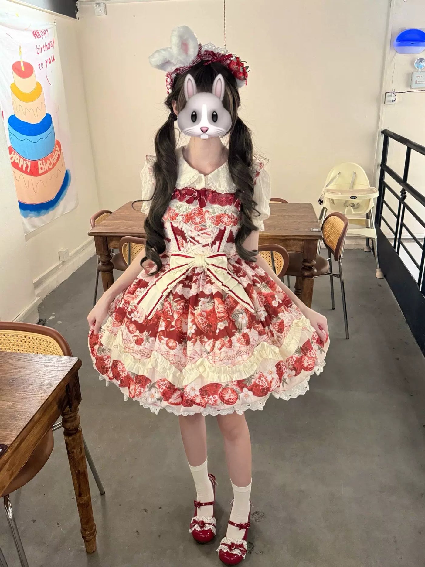 Creamy red-and-cream strawberry-print JSK set with layered ruffles and headwear.