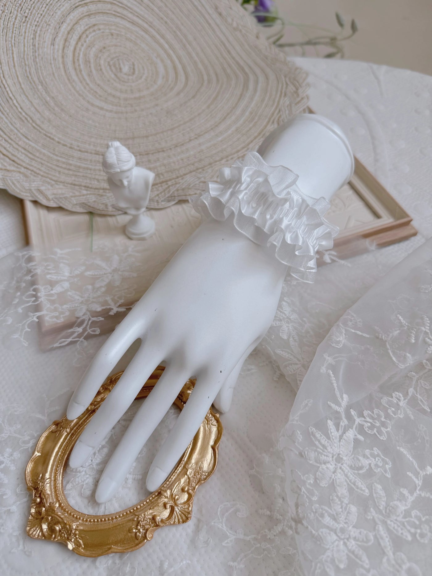 White satin ribbon Lolita bracelet on display