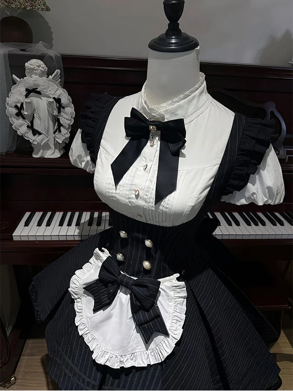 Black-and-white blouse and pinstriped dress set with bows and a white ruffled apron panel.