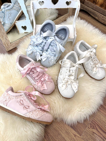 Sheep Puff Angel Pearl Lo-Run Lolita sneakers showing white shoes with angel pearl embellishments and lace-up design.