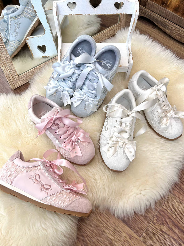 Sheep Puff Angel Pearl Lo-Run Lolita sneakers showing white shoes with angel pearl embellishments and lace-up design.