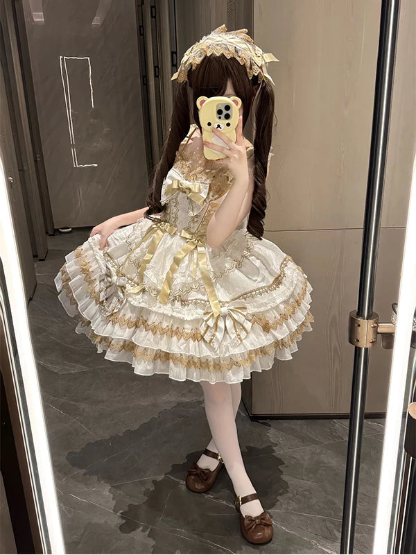 White and gold-toned ruffled JSK suspender dress styled in a mirror photo.