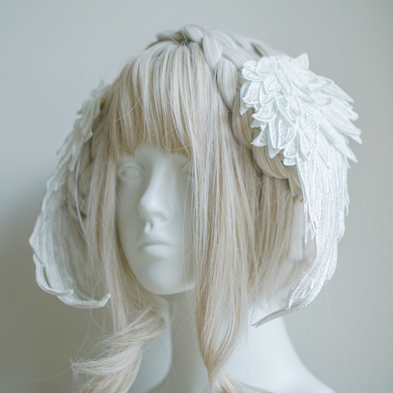 Black and white embroidered angel wings hair clip headdress with feather details, stylish LolitaFetch accessory for elegant hair styling.