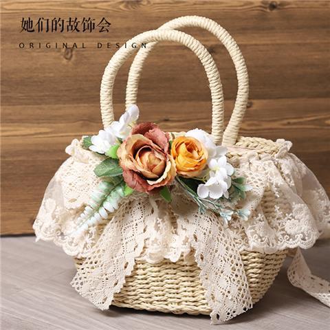 Handmade straw tote bag by LolitaFetch featuring lace, artificial flower accents, perfect for beach or pastoral style.