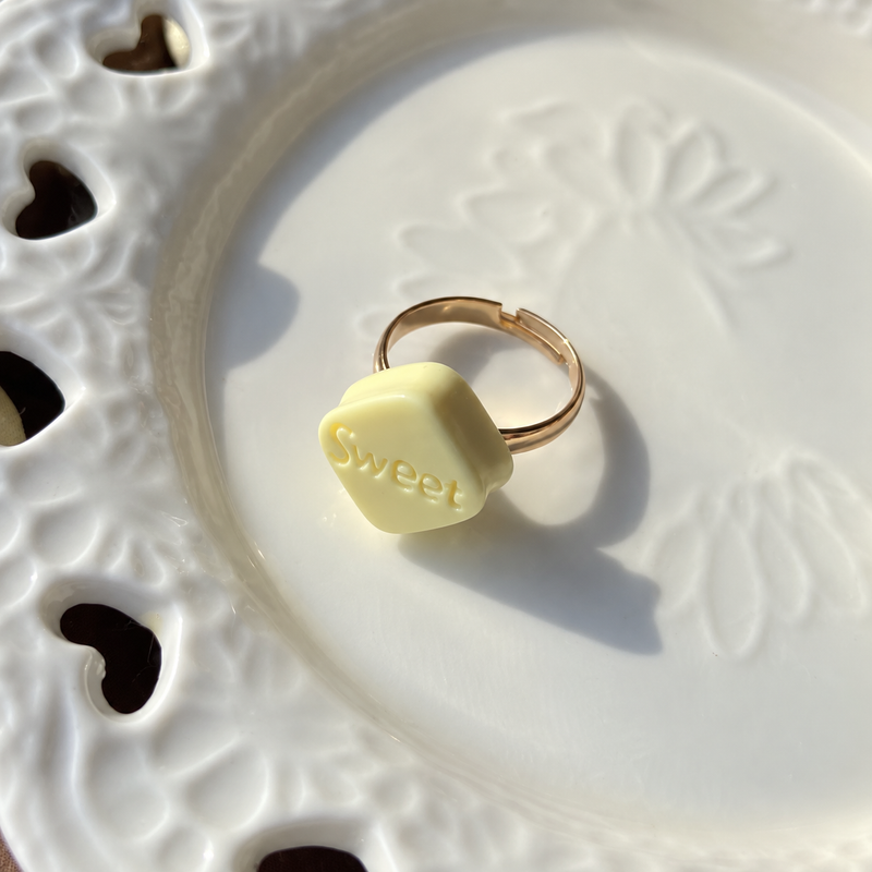 Bear doll sweet white chocolate adjustable ring, close-up showing the charm and gold-tone band.