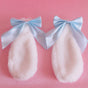 Une paire de barrettes à cheveux oreilles de lapin bleu clair avec nœud
