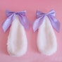 Une paire de pinces à cheveux oreilles de lapin avec nœud papillon violet clair