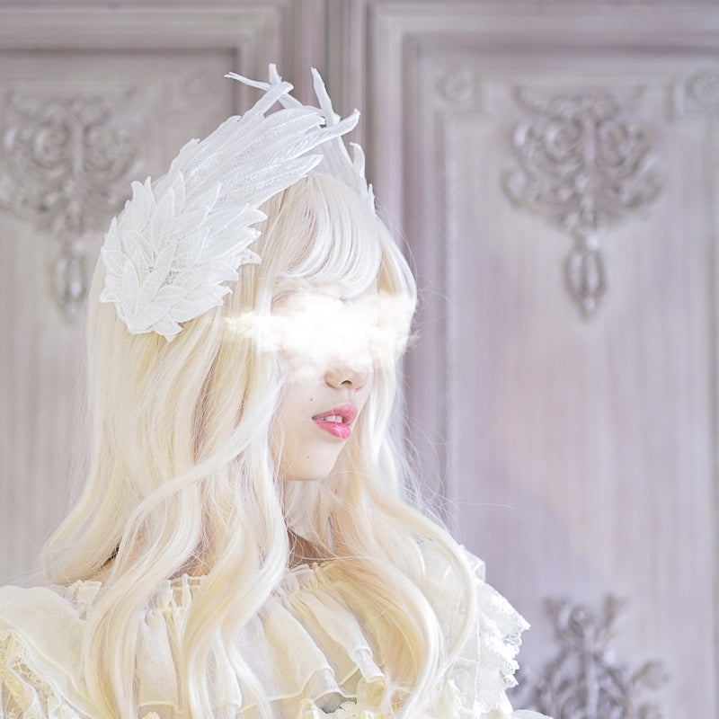 Black and white angel wing feather headdress with embroidered details, styled as a LolitaFetch Lolita hair clip accessory.