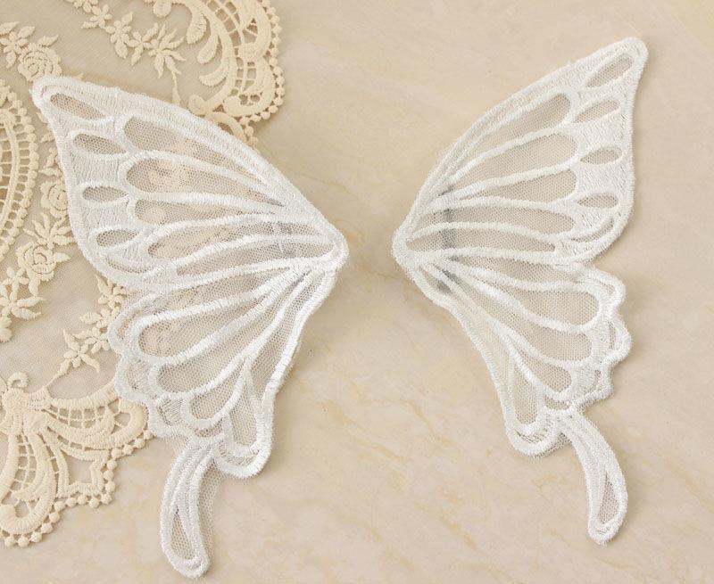 Large white butterfly hair accessory from LolitaFetch, elegant and decorative hairpiece with intricate butterfly design.