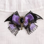 Pince à cheveux nœud papillon ornée de pierres précieuses