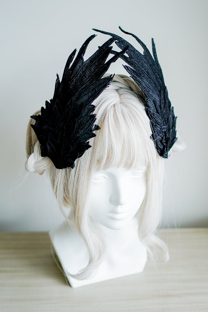 Black and white embroidered angel wings lolita feather headdress with two-tone design and hair clip detail by LolitaFetch.