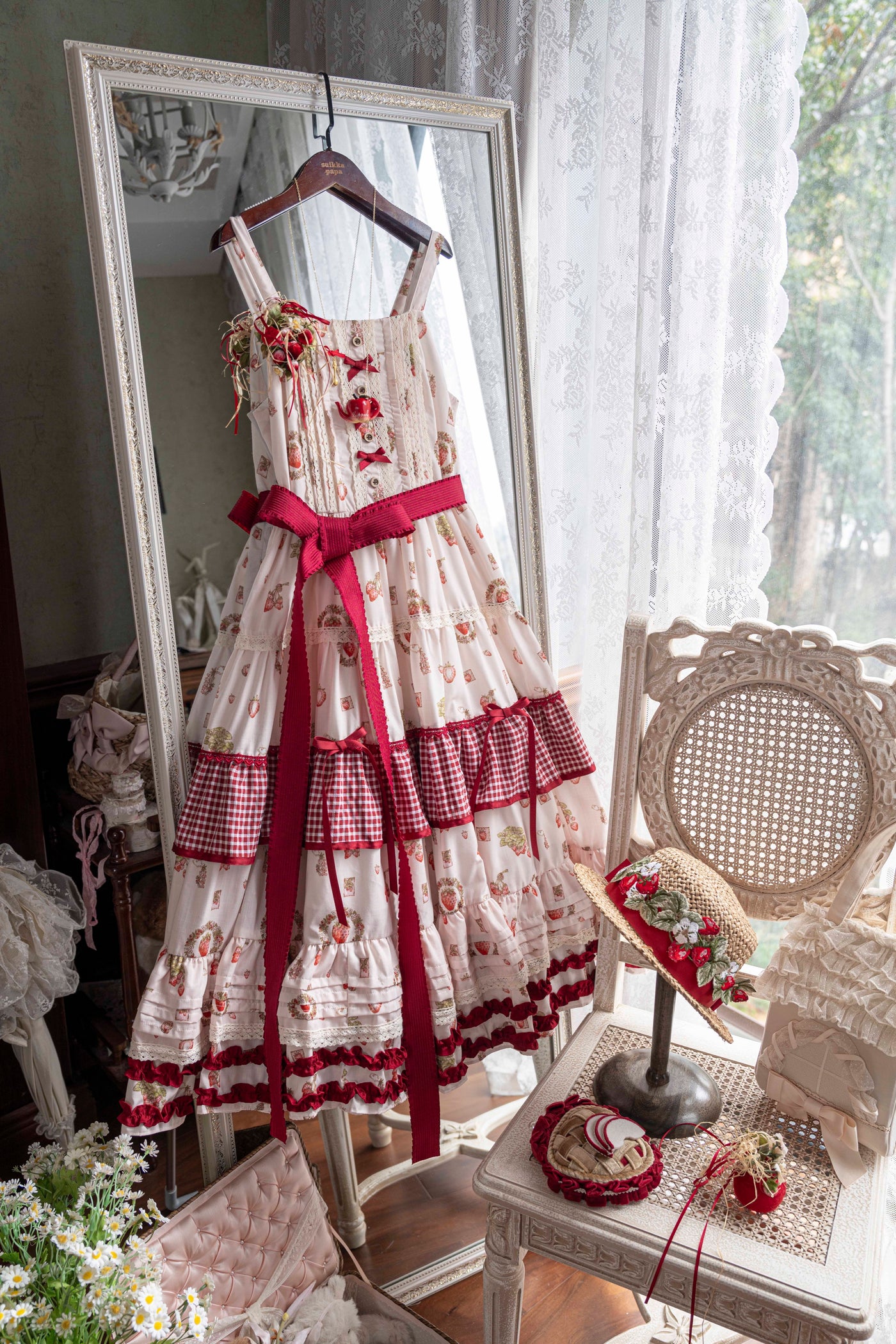 Detail of ruffled lace hem and adjustable shoulder strap on the Lolita JSK