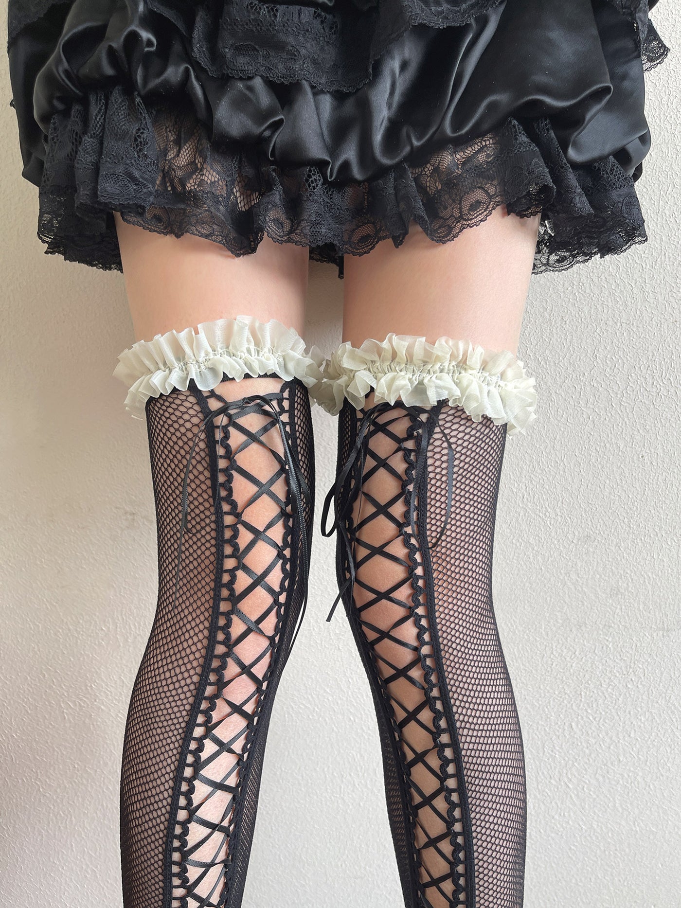 White and pink strap style Y2K ballet lace over-knee sock with criss-cross ribbon lacing and ruffled trim