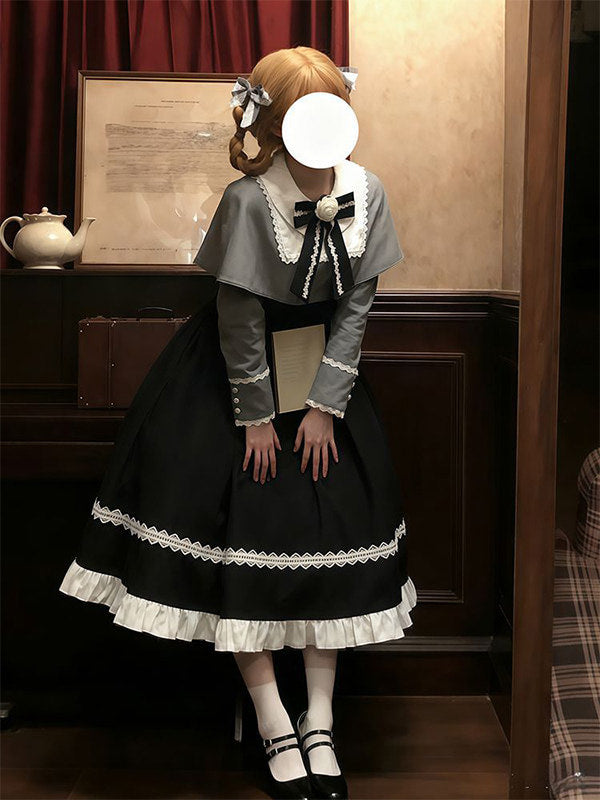 Close-up of the black bow with white floral center at the neckline of the Gothic Lolita dress.