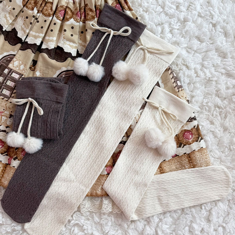 Black over-the-knee Sweet Lolita socks with pom-pom bow cuff