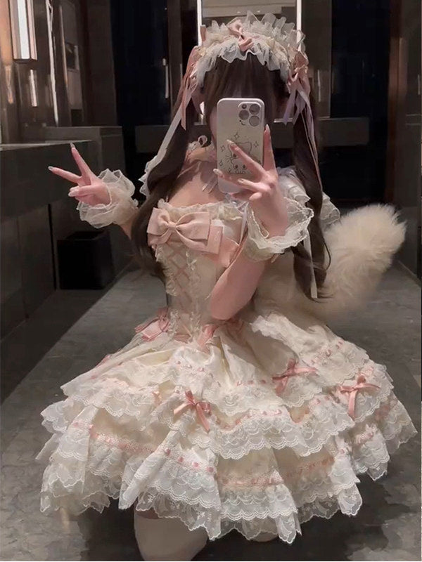 Tiered cream JSK dress with lace trim and pink bows.