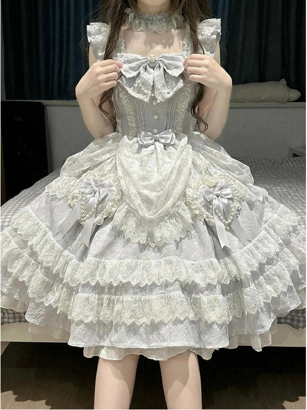 Detail view of waist bow and hip pearl and ribbon embellishments on sweet lolita dress
