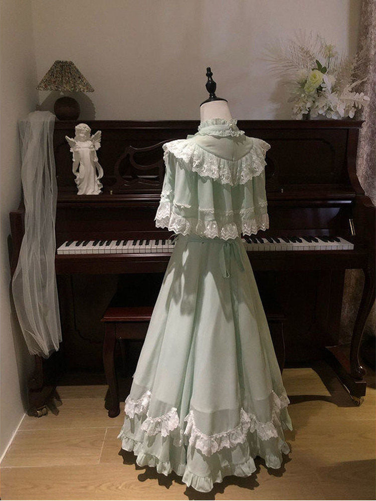 Detail of the lace-trimmed high neck and short puffed sleeve on the mint green Lolita dress