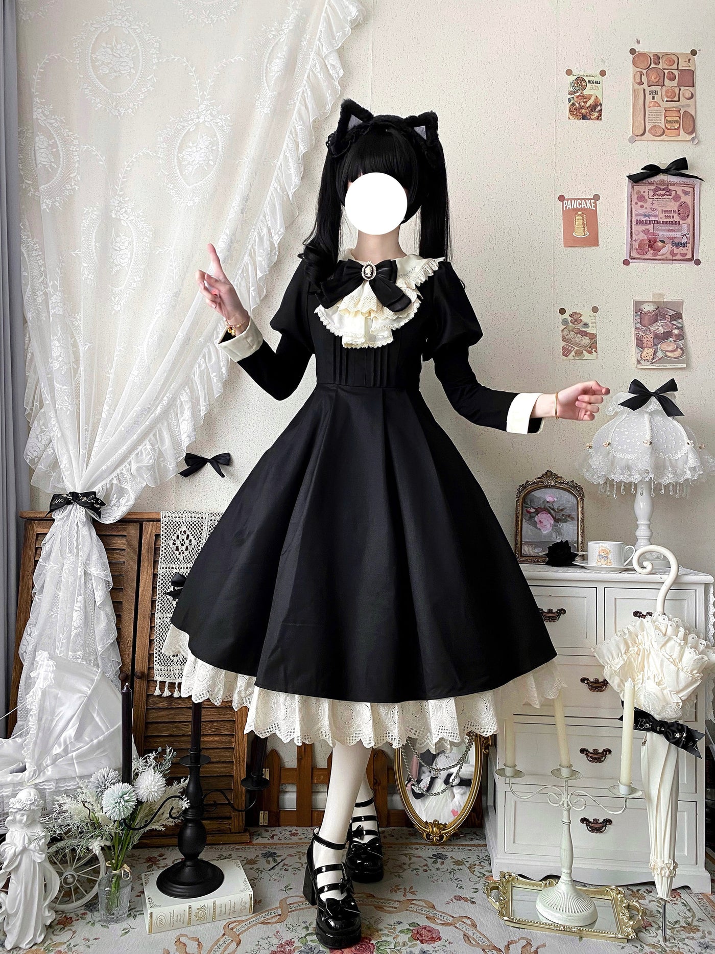 Close-up of cream pinafore apron with black buttons, ribbon bows and eyelet lace trim