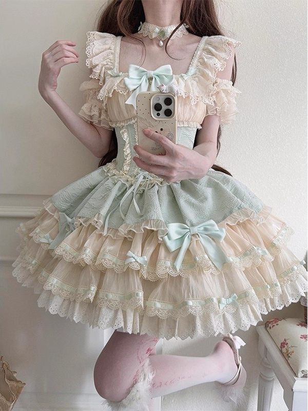 Green and cream tiered JSK dress with lace trim and bows.