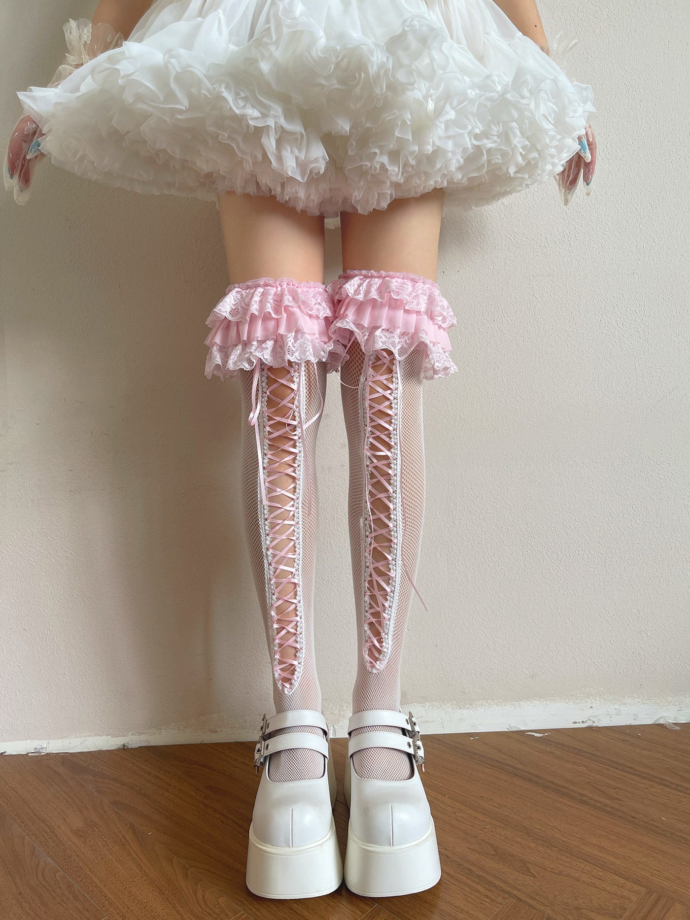 Pink over-the-knee Lolita sock with white base, pink lace trim and pink ballet straps