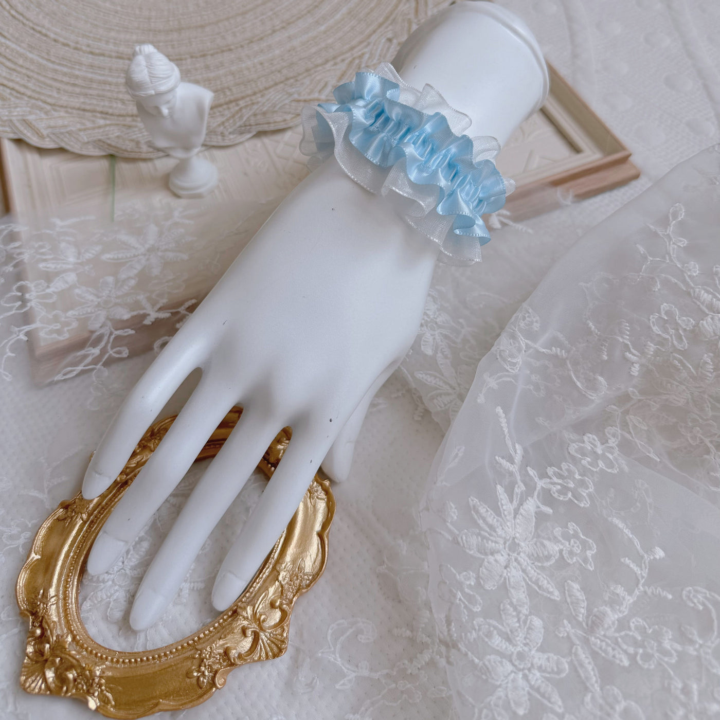 White satin ribbon Lolita bracelet on display