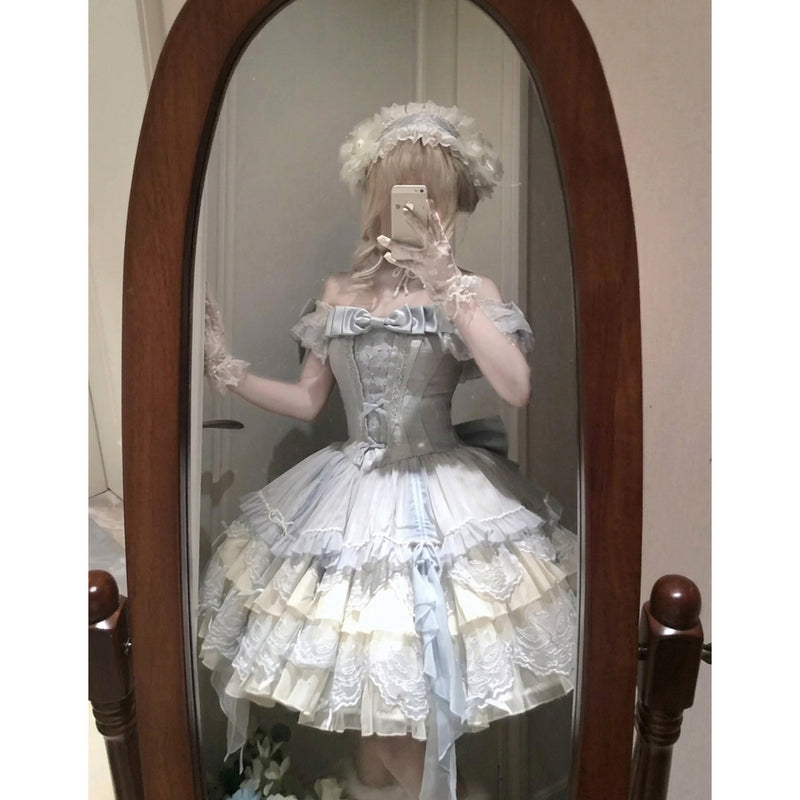 Detail shot of tiered blue lolita skirt with appliqué lace and ribbon streamers