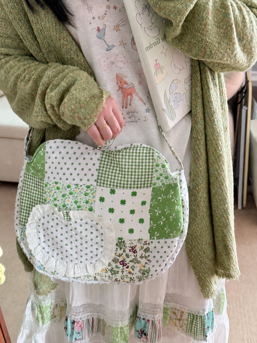 Green apple patchwork shoulder bag worn crossbody