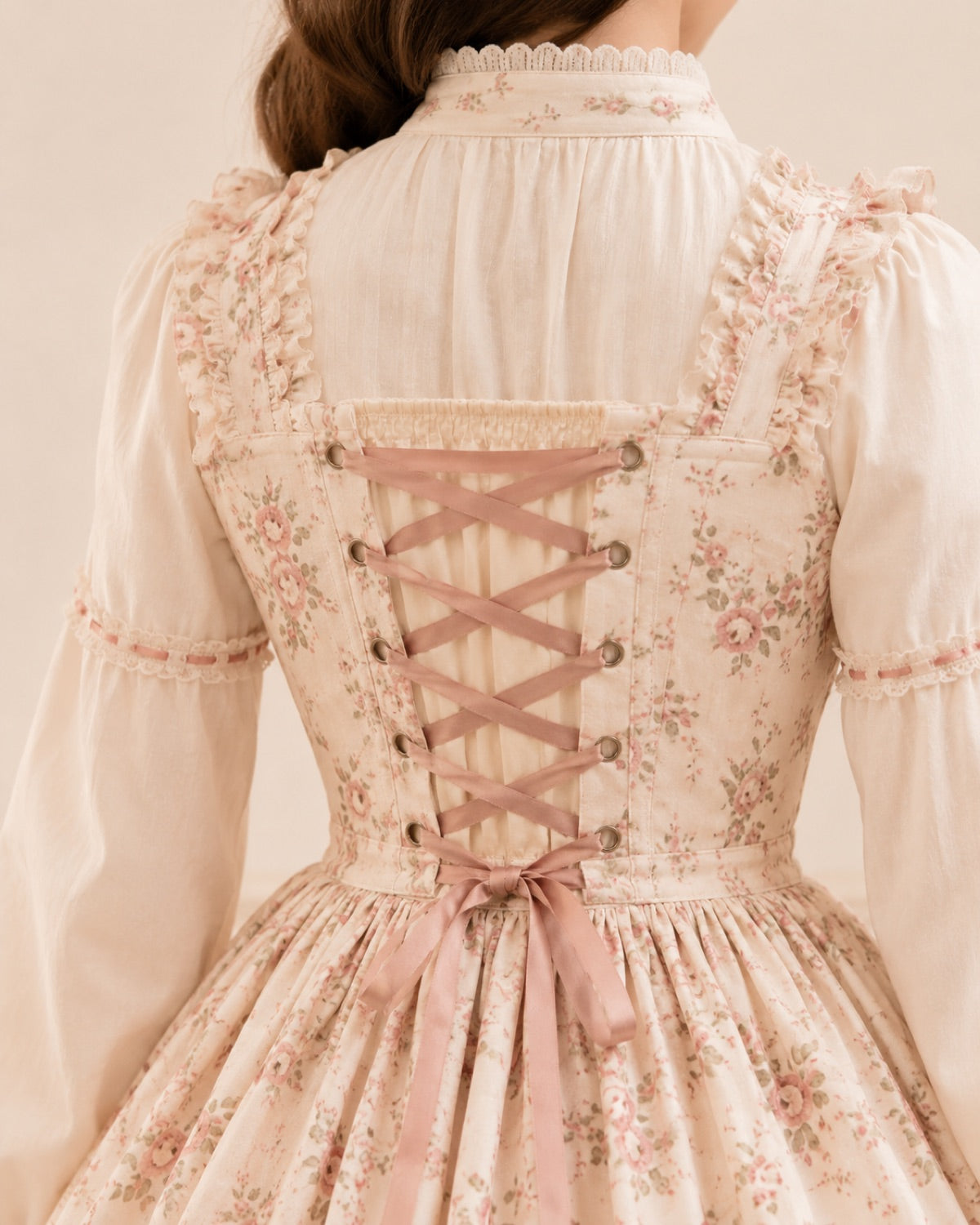 Corset lacing on the back of a floral Lolita dress.